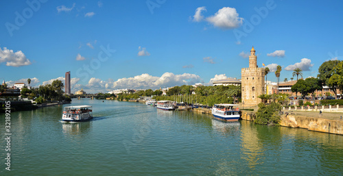 Panorama of Seville, the Golden Tower and the embankment of the river.