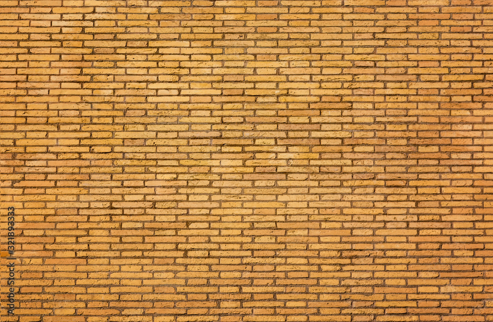 Background of yellow brick wall texture. Abstract architecture details Background of yellow brick wall texture. Abstract architecture details