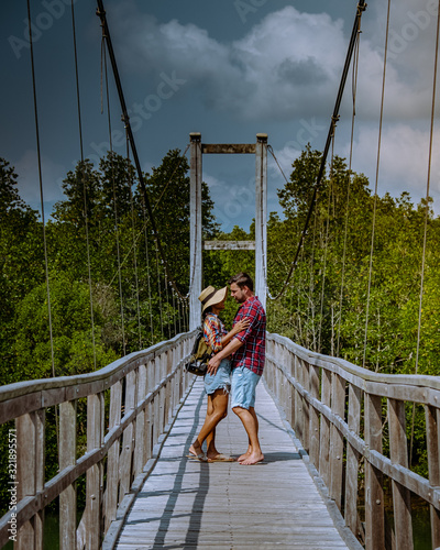 MuKo Chumphon National park,Thailand , couple walking on wooden deck in the park with trees and mangrove in Chumphon Thailand photo