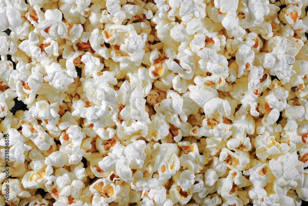 The texture of salted popcorn. Background. View from above. The texture of salted popcorn. Background. View from above.
