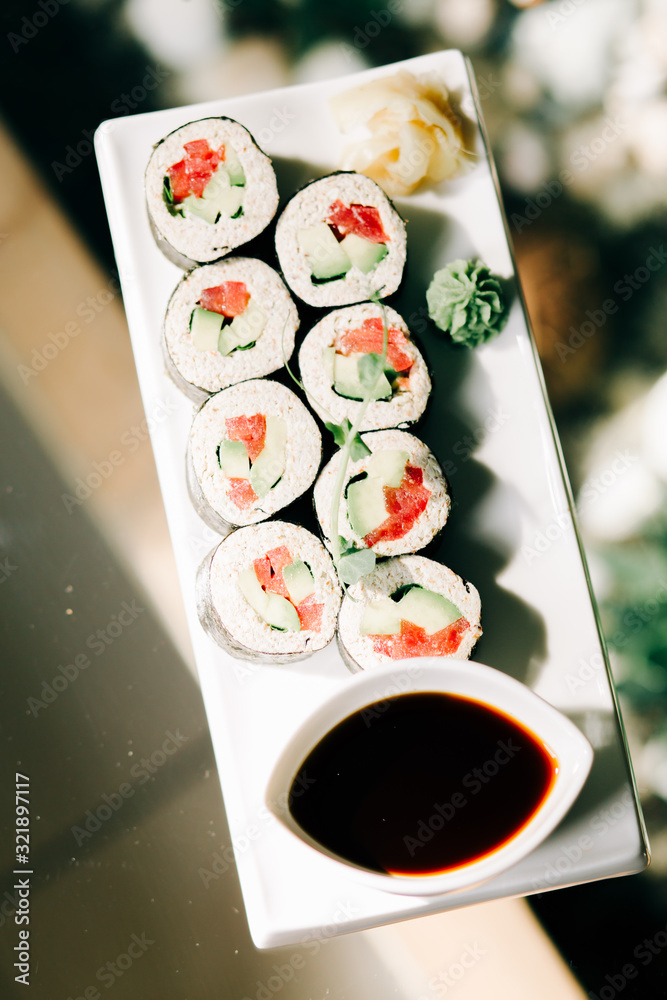 delicious vegan rolls with vegetables on a white plate in a health food restaurant. vegan food delicious vegan rolls with vegetables on a white plate in a health food restaurant. vegan food