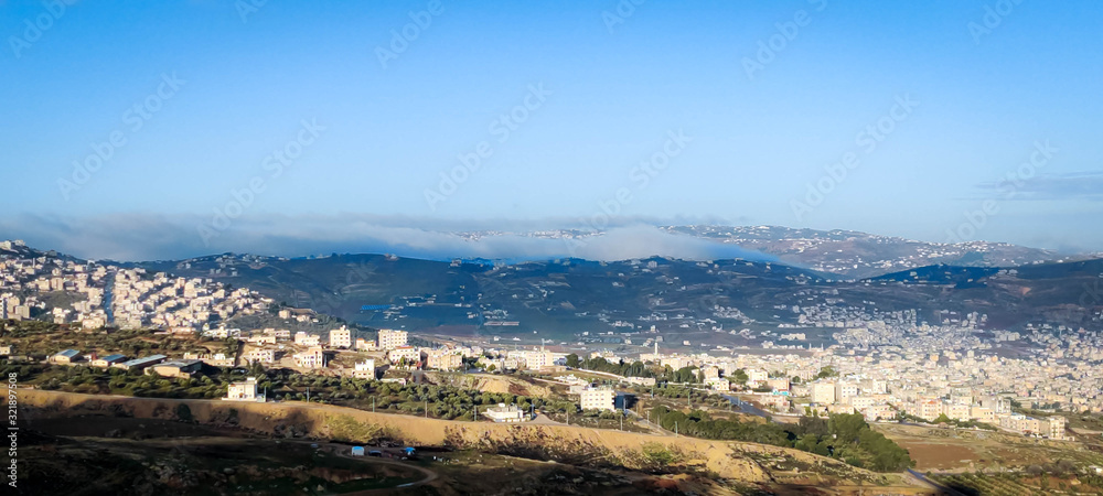 cloudy sky and fog come over village  