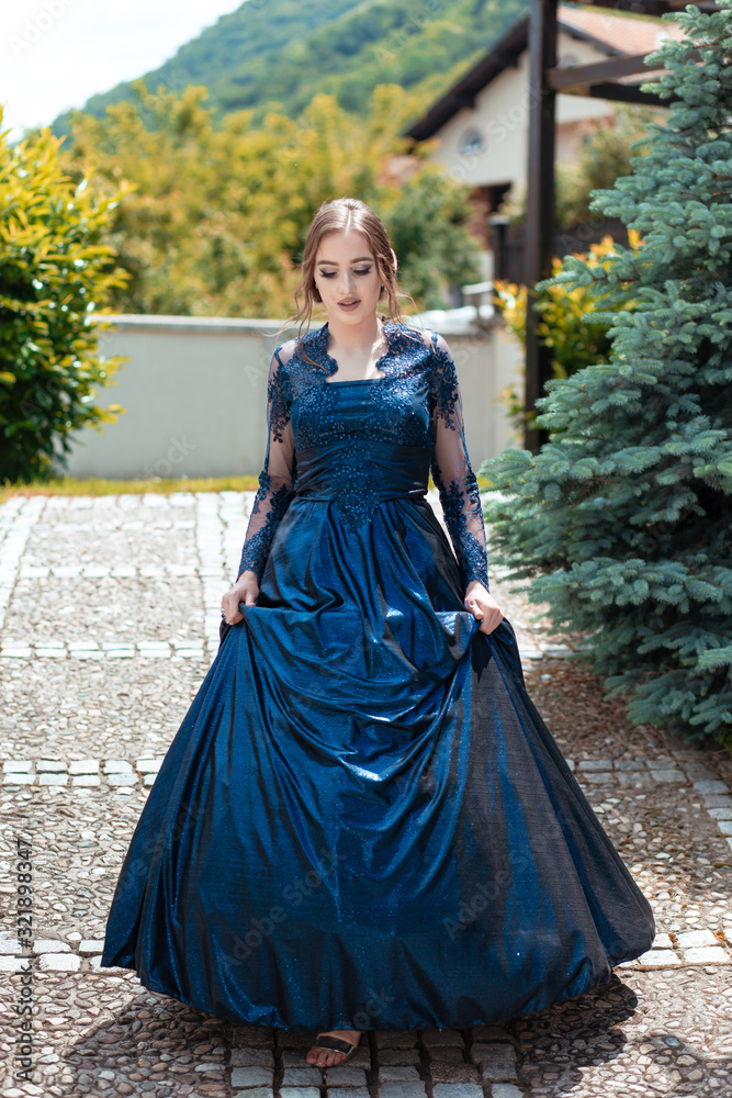 Beautiful girl in glamorous ultramarine dress. Ready for her prom night. Beautiful girl in glamorous ultramarine dress. Ready for her prom night.