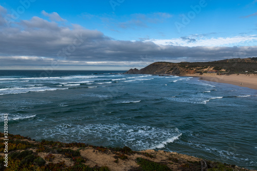 Beautiful rocky coastline and blue sea in Portugal © Alexey Seafarer