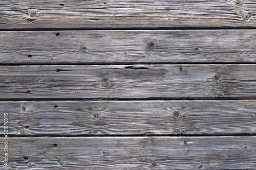 Dark wooden background texture. Old fence panels with natural patterns.