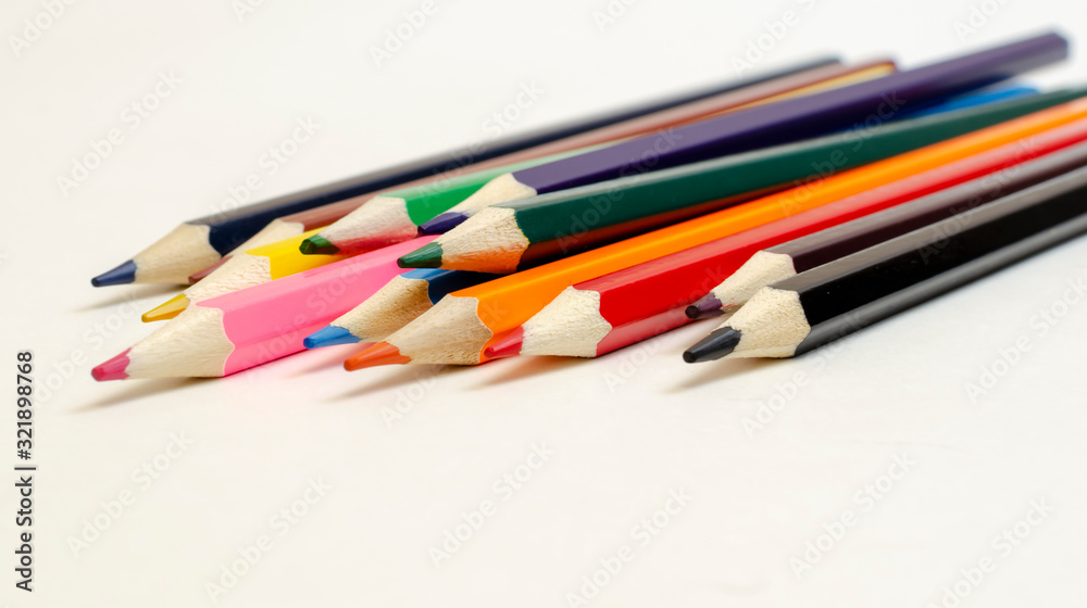 set of colored pencils on a white background