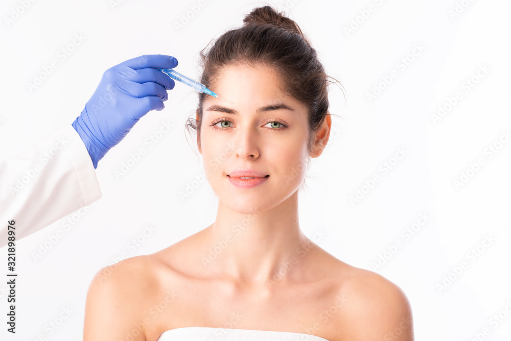 Woman getting botox treatment on her face Woman getting botox treatment on her face