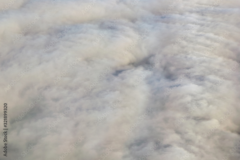 Top view on dense white clouds.
