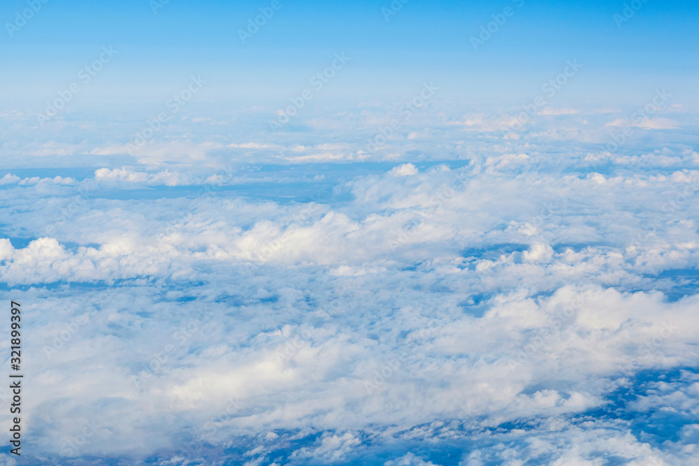 View over the clouds. Blue sky and clouds. View over the clouds. Blue sky and clouds.
