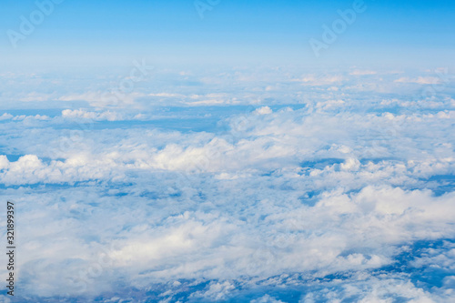 View over the clouds. Blue sky and clouds. © Konstiantyn Zapylaie