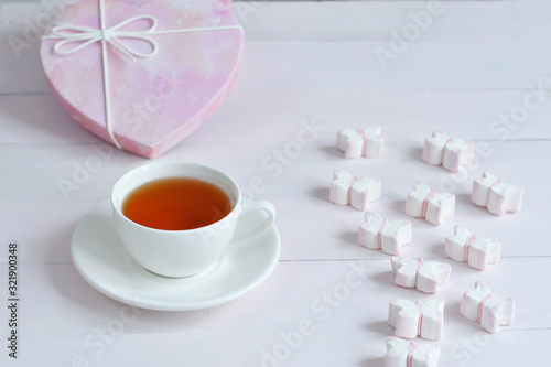 Pink marshmallow on table with tea.Valentine card.Template greeting card for Valentine's Day. Spring card for Mother's Day, Women's Day.copy space. March 8.breakfast for loved ones