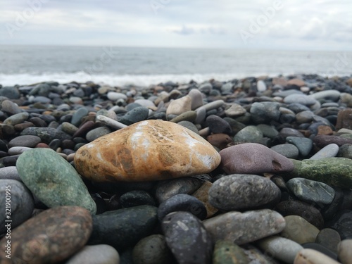 Canvas-taulu pebbles on the beach