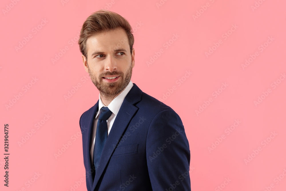 Happy businessman looking away and smiling Happy businessman looking away and smiling