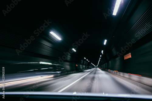 Motion blur of car moving inside tunnel