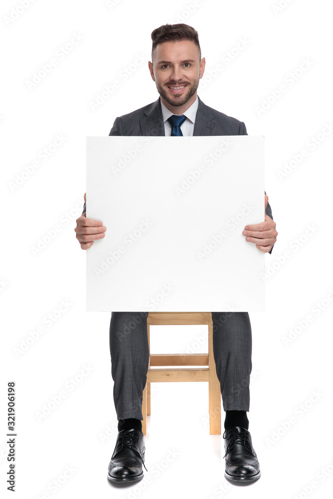 smiling fashion model holding empty board smiling fashion model holding empty board