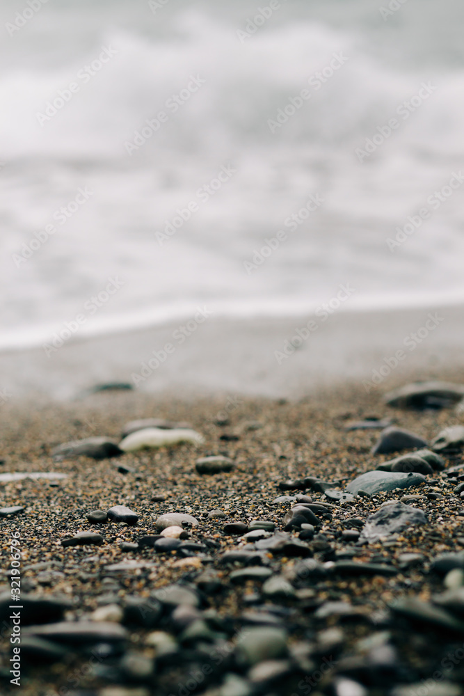 the sea wave arrives on the sandy shore . beautiful natural background the sea wave arrives on the sandy shore . beautiful natural background