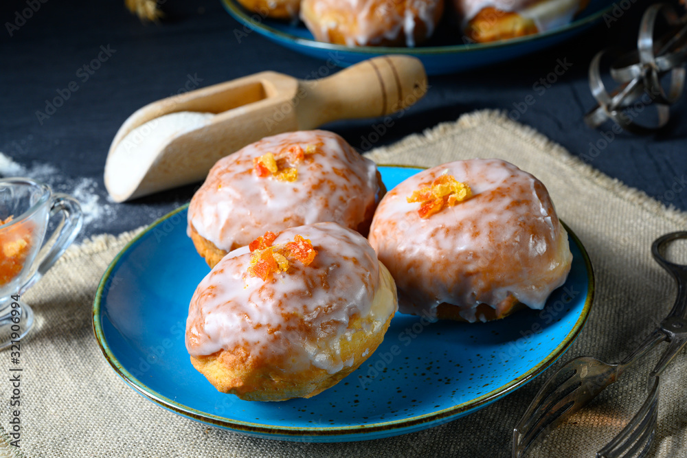Fine Berlin donuts with jam filling and icing Fine Berlin donuts with jam filling and icing