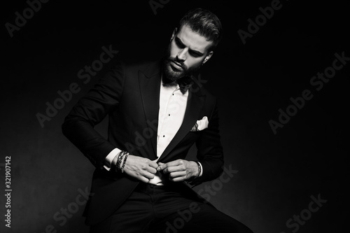 businessman sitting and opening jacket dramatic photo