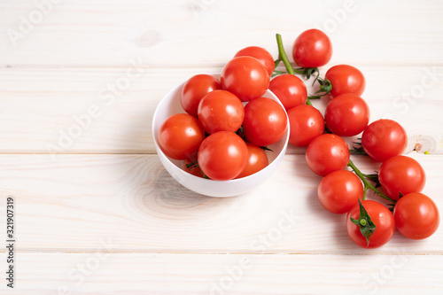 Cherry tomatoes on the white wooden table