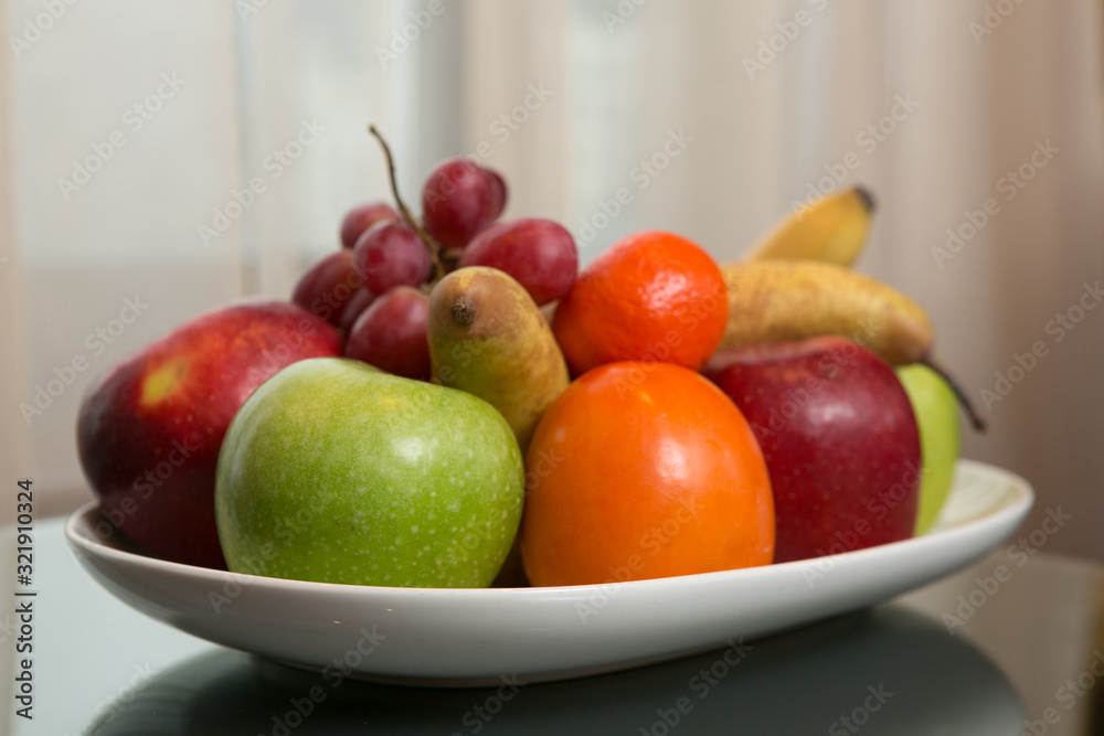 Mixed fruit platter on the table. Shallow dof Mixed fruit platter on the table. Shallow dof