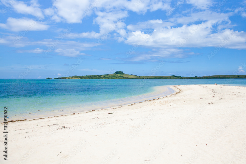 Tropical island with a lagoon and white sandy beach. Cotivas Island Cottage. Caramoan Islands, Philippines. Tropical island with a lagoon and white sandy beach. Cotivas Island Cottage. Caramoan Islands, Philippines.