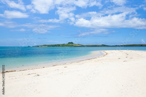 Tropical island with a lagoon and white sandy beach. Cotivas Island Cottage. Caramoan Islands, Philippines.