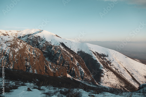 snowy mountain under blue sky background