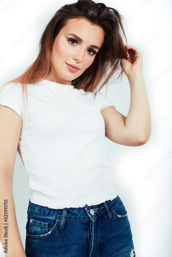 young pretty teenage hipster girl posing emotional happy smiling on white background, lifestyle people concept