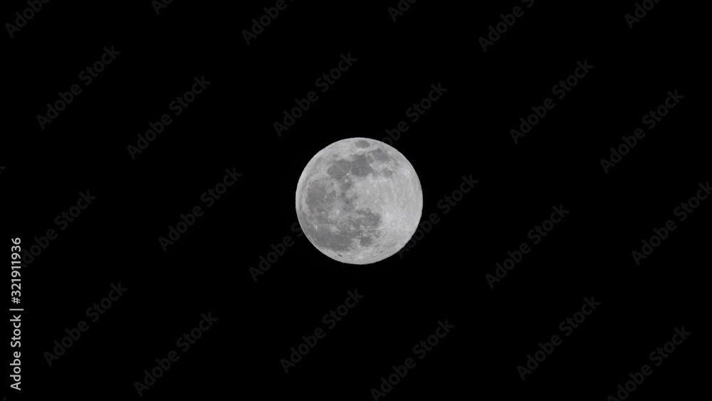 Supermoon, Full Moon, Snow Moon, Hunger Moon in February against a Clear Black Night Sky Background 16 by 9 widescreen Supermoon, Full Moon, Snow Moon, Hunger Moon in February against a Clear Black Night Sky Background 16 by 9 widescreen