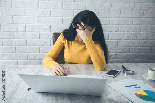 sad woman in office table background