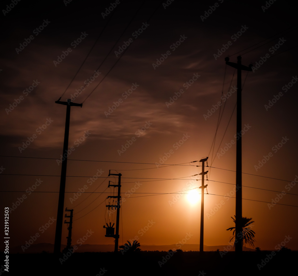 power lines silhouette at sunset
