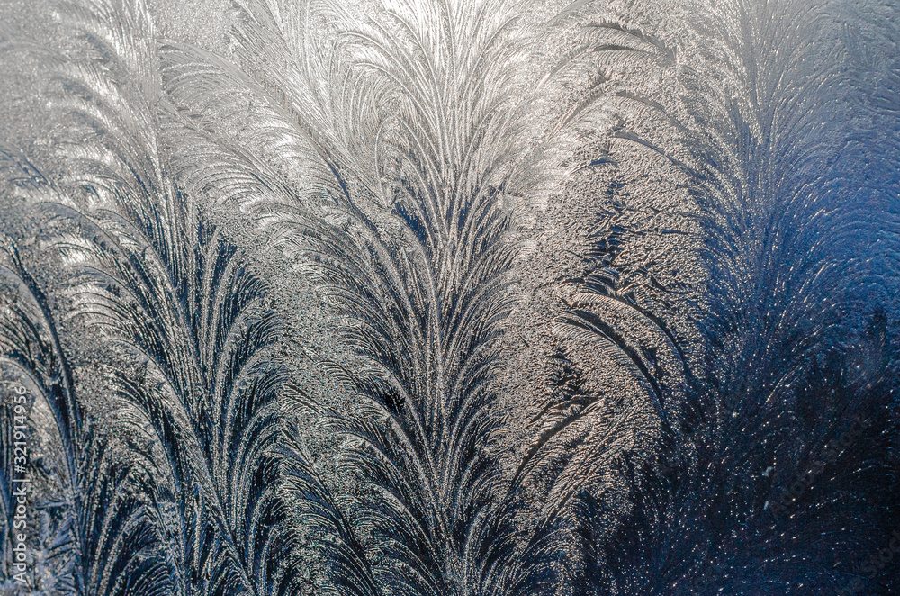 Beautiful ice pattern on winter glass, natural texture. Background. Beautiful ice pattern on winter glass, natural texture. Background.