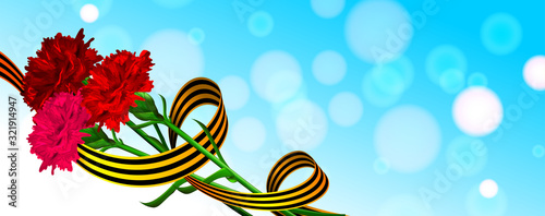 St George ribbon and red carnation on blue