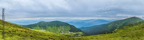 Panorama of beautiful  green mountains with clouds and forest. Ukraine  Carpathians.