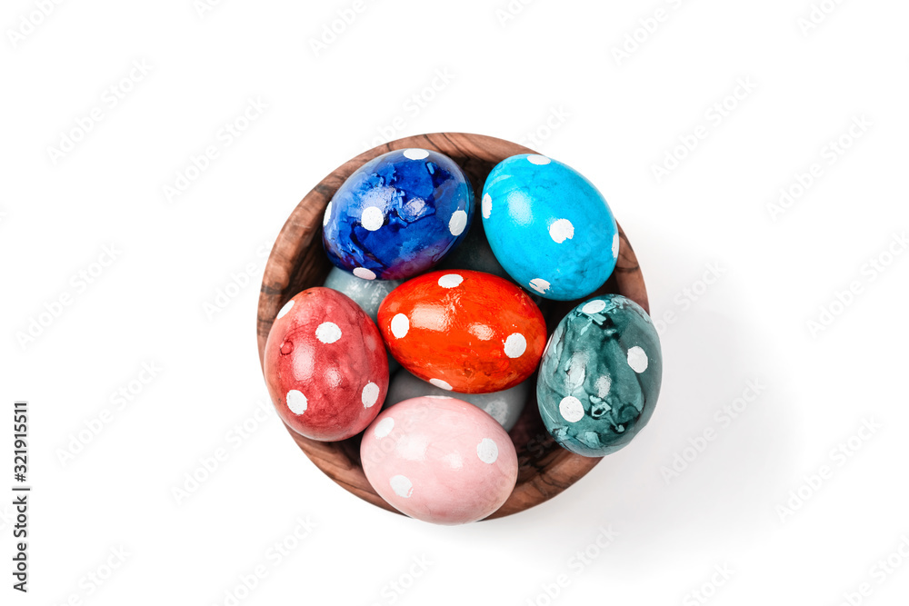 Different easter eggs in ceramic bowl isolated on white Different easter eggs in ceramic bowl isolated on white