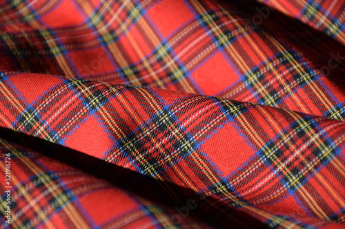 Red tartan fabric close up 