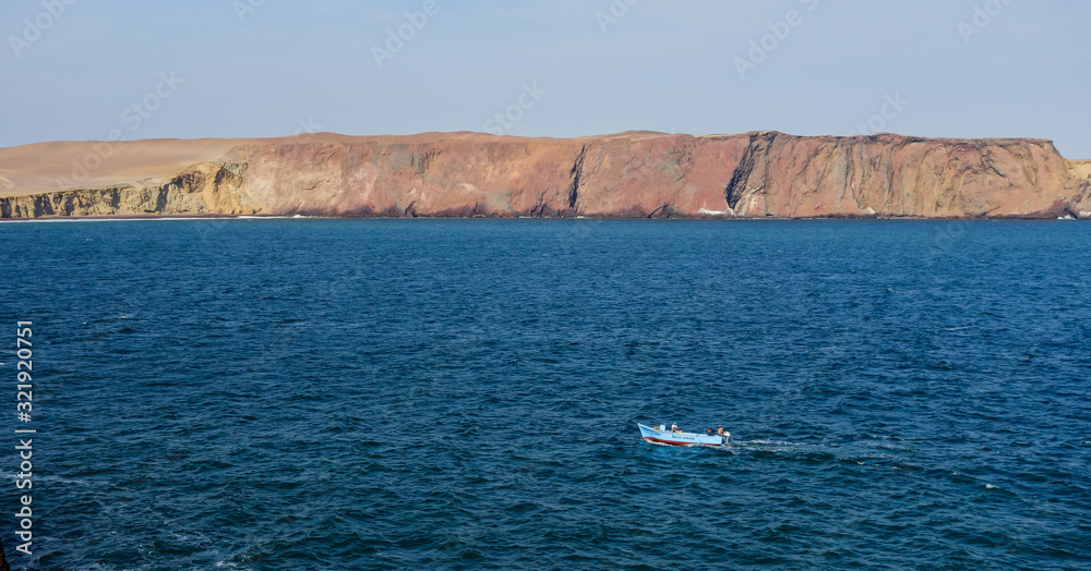 Ica/Peru - Sep.26.19: fishing boat sailing in Pacific ocean in the coast of Paracas.