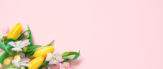 Pink banner with spring flowers and lights, festive composition for spring holidays