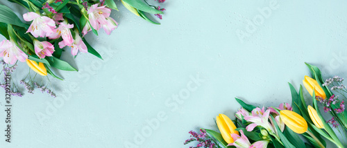 Blue banner with spring flowers, festive composition for spring holidays photo