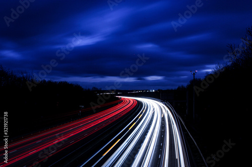 M1 traffic on highway at night with light trails 