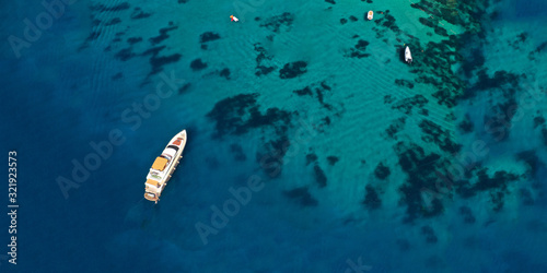 Aerial drone ultra wide photo of famous celebrity beach of Psarou in island of Mykonos, Cyclades, Greece