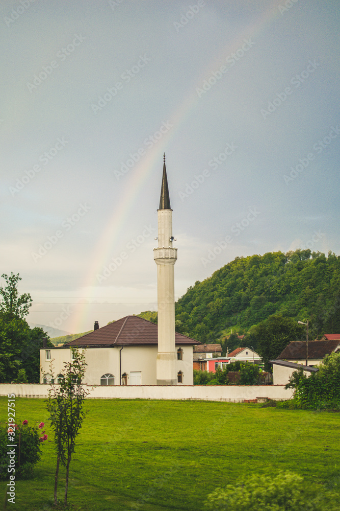 mosque in rainbow sky