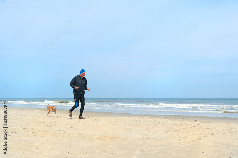 Senior man running at the beach