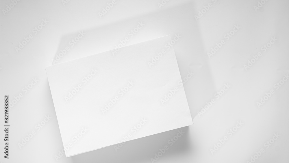 Stack of white office paper on light background, top view, place for text. Stack of white office paper on light background, top view, place for text.