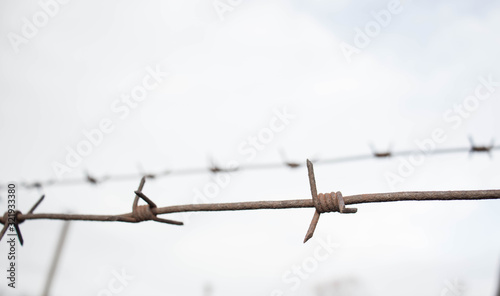 barbed wire against the sky restriction of freedom hope for the future