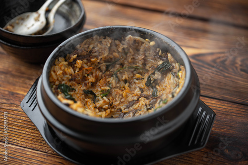 making crispy rice with korean hot stone bowl bibimbap