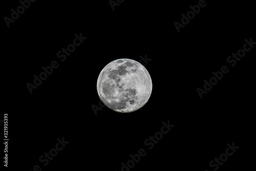 Full Snow moon in night sky