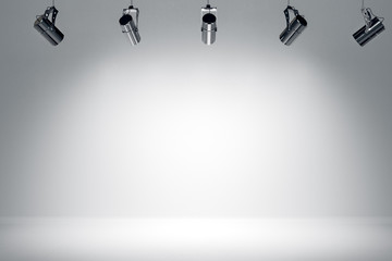 Illuminated white stage with spotlight