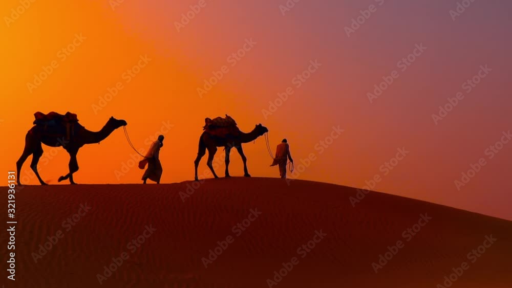 Cameleers, camel Drivers at sunset. Thar desert on sunset Jaisalmer, Rajasthan, India. Cameleers, camel Drivers at sunset. Thar desert on sunset Jaisalmer, Rajasthan, India.