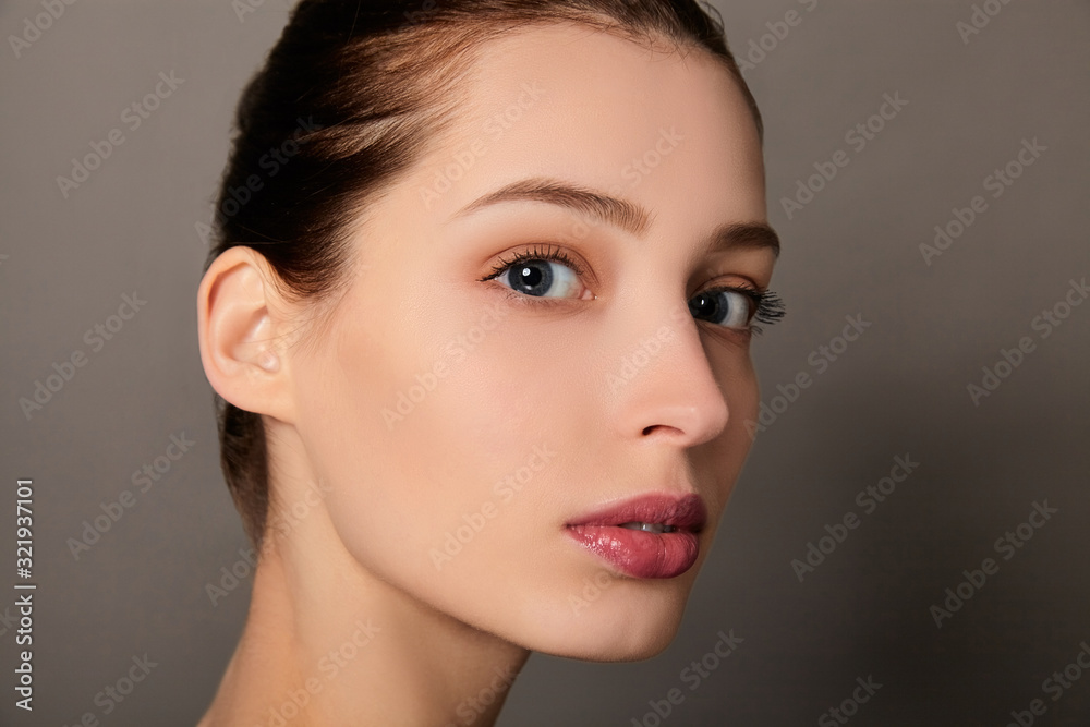 Close-up the face of a young beautiful white girl. Close-up the face of a young beautiful white girl.